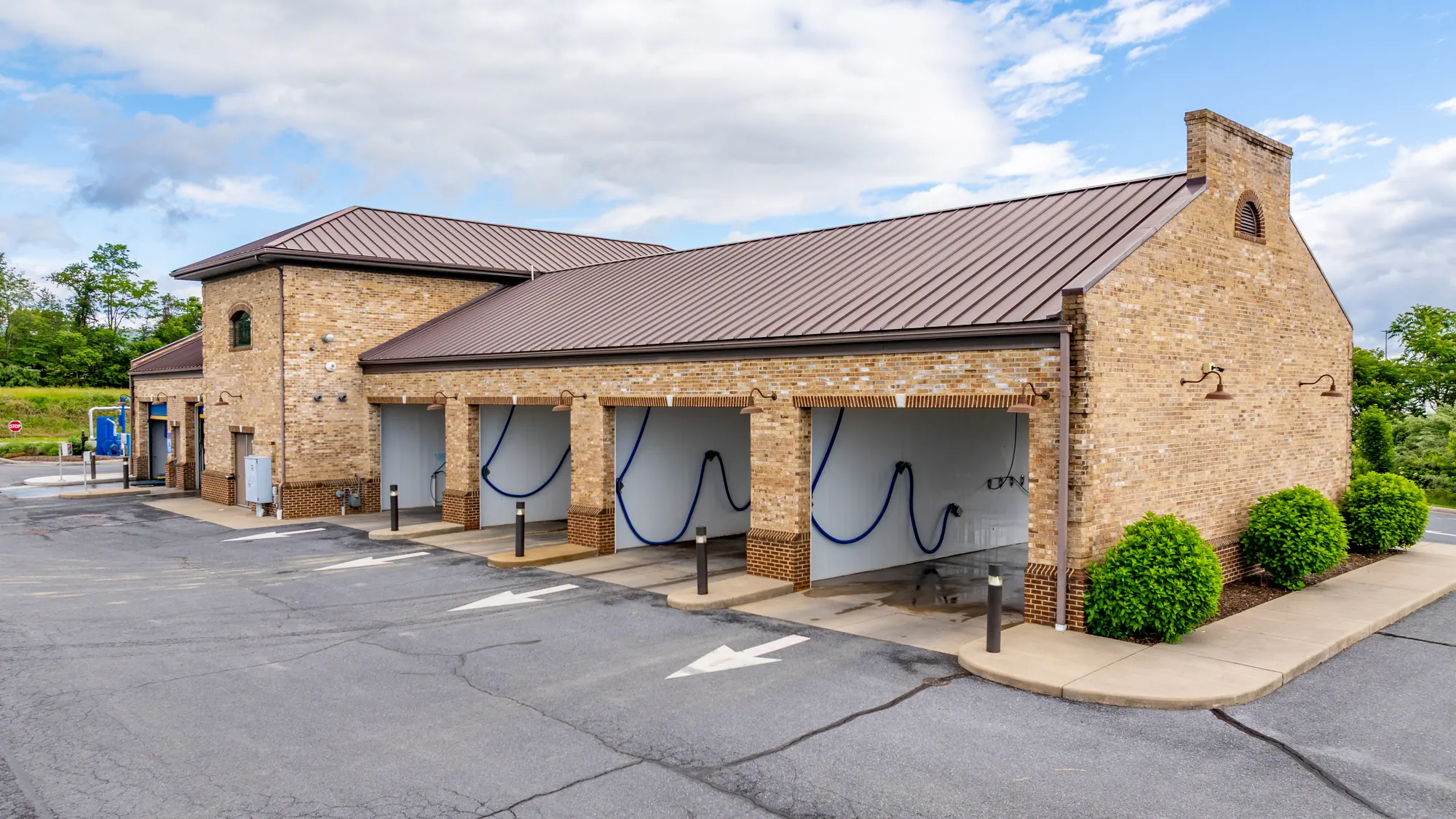 Row of self-serve wash bays at Woodstock Car Wash in Woodstock, Virginia