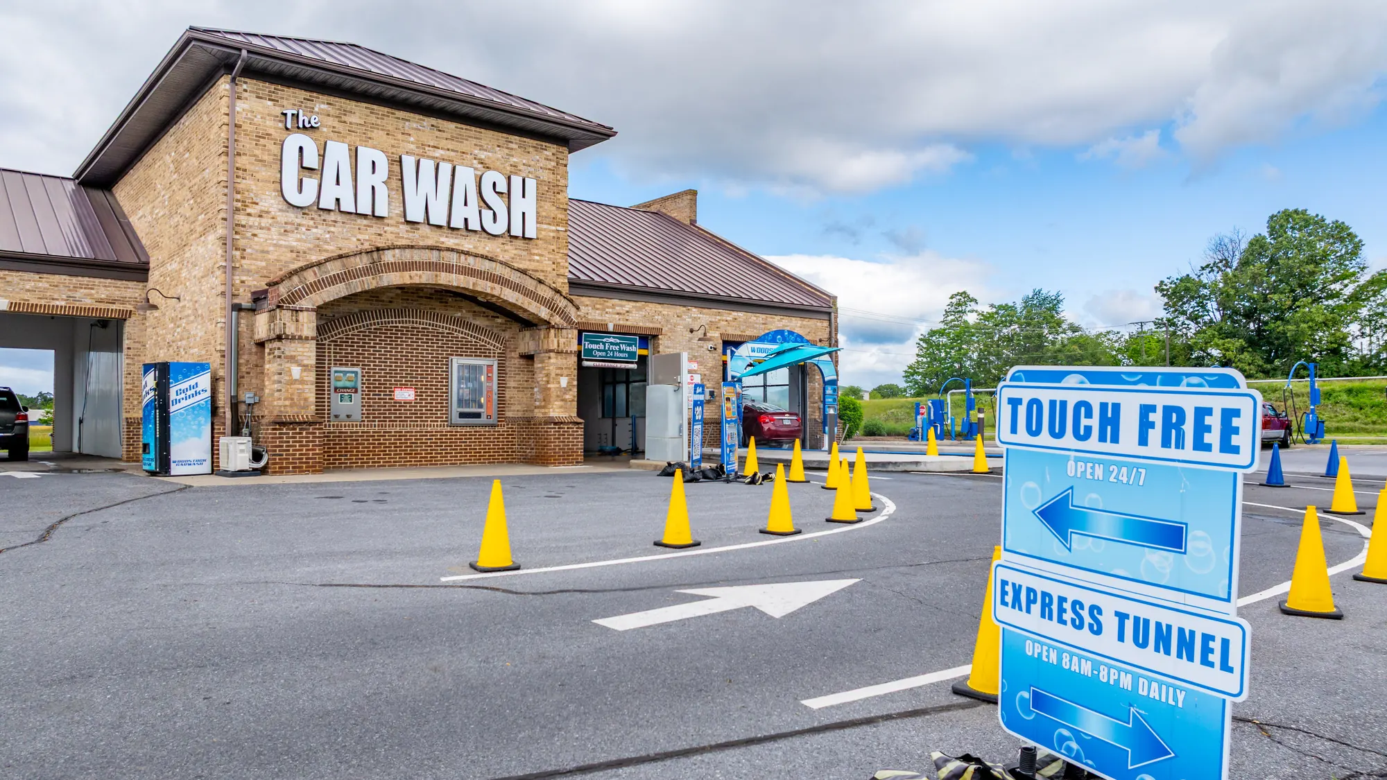 Touch free and express tunnel direction sign at Woodstock Car Wash in Woodstock, Virginia